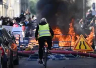 On the Barricades with Wheelie Bins and Shopping Trolleys: Paris Students Rage at Politicians and Police